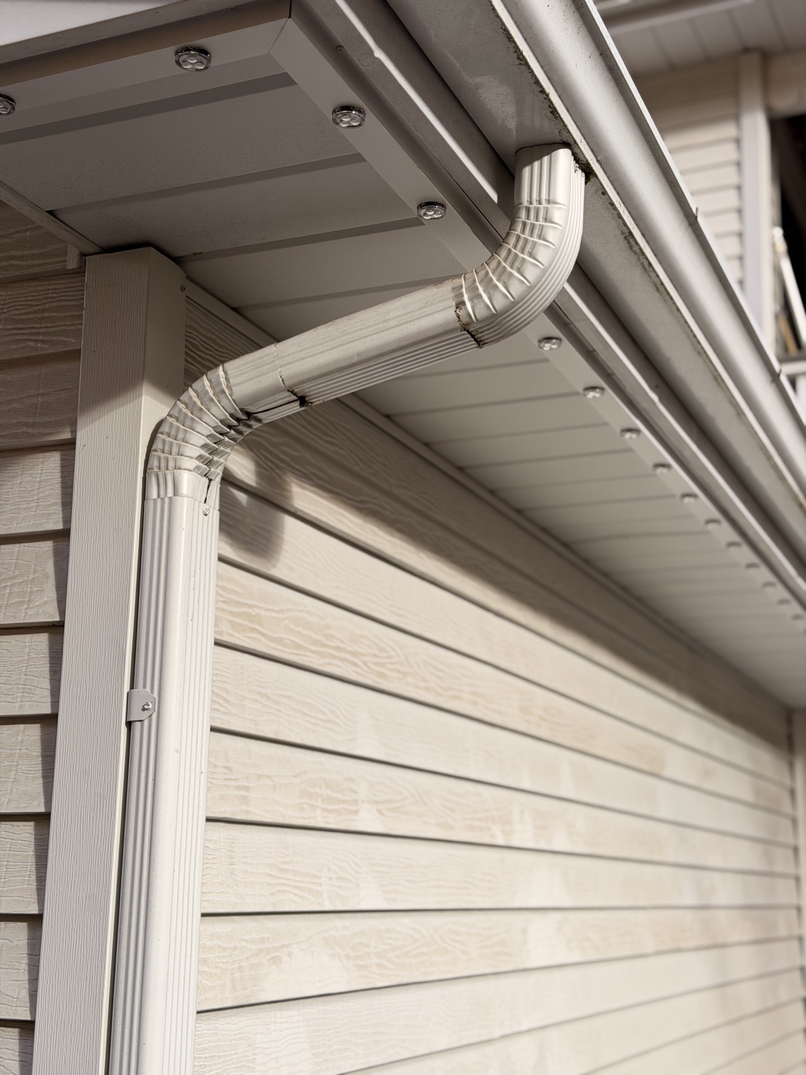Close-up of the powder-coated aluminum channel integrated along the roofline trim